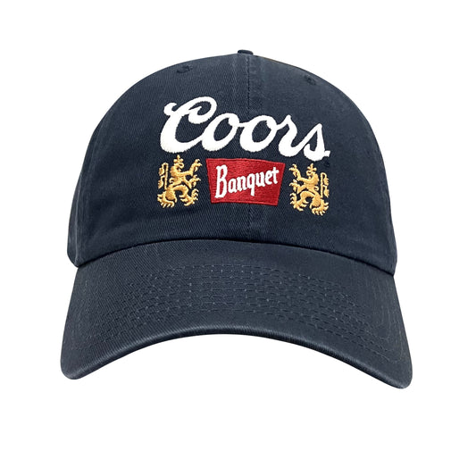 Navy baseball cap with embroidered Coors Banquet logo and gold lion emblems.